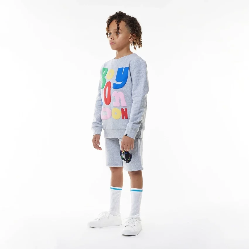 Pantalones cortos con insignia para BOY